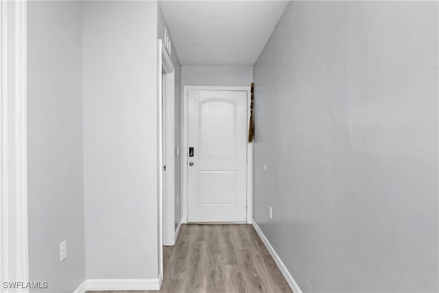 hallway with light wood-type flooring