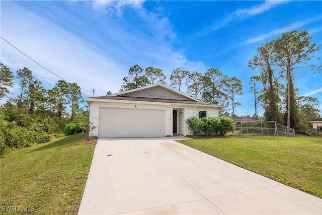 single story home featuring a front lawn and a garage