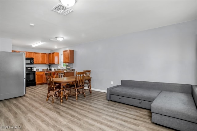 dining area featuring light hardwood / wood-style flooring