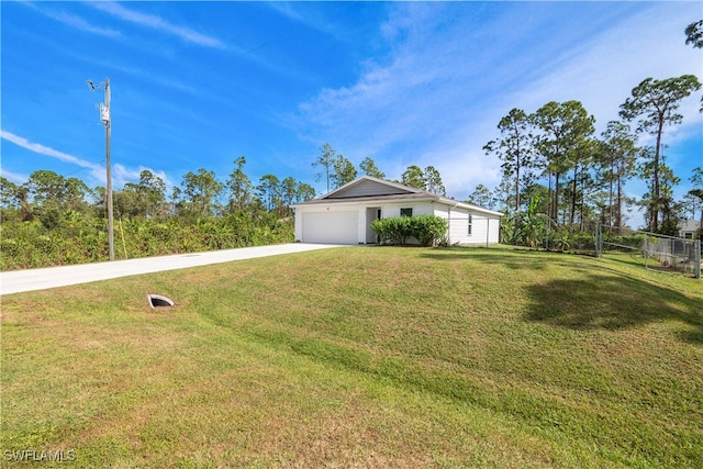 view of front of house with a front lawn and a garage