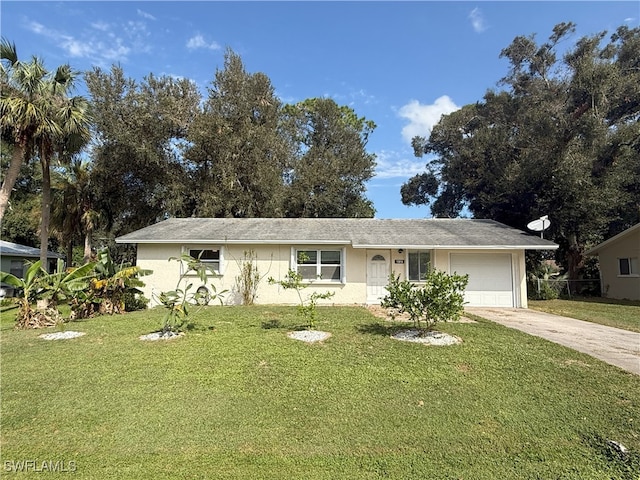 single story home with a front yard and a garage