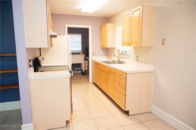 kitchen with light tile patterned flooring, exhaust hood, sink, and light brown cabinetry