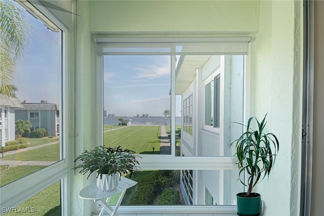 sunroom / solarium featuring a healthy amount of sunlight