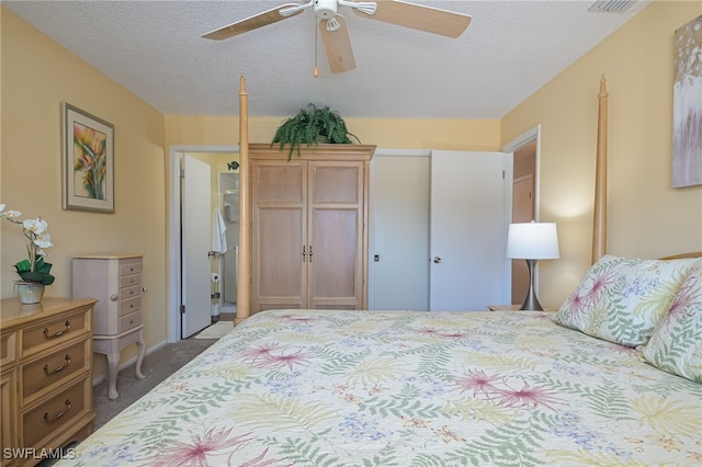 carpeted bedroom featuring a textured ceiling and ceiling fan