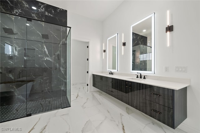 bathroom featuring vanity and a shower with door