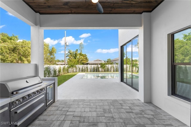 view of patio with a fenced in pool, a grill, and ceiling fan