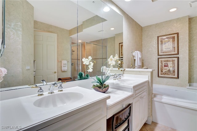 bathroom featuring vanity, plus walk in shower, and tile patterned flooring