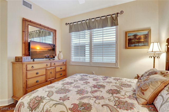 bedroom with hardwood / wood-style floors