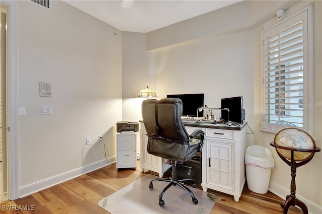 office space with light hardwood / wood-style flooring