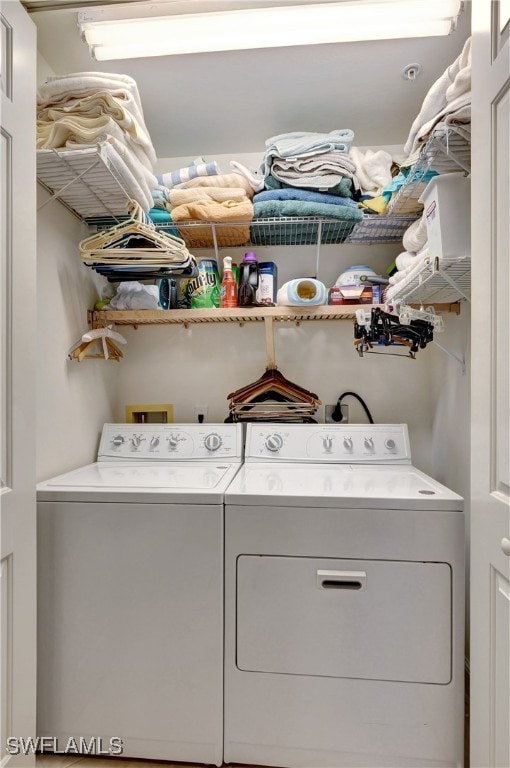 washroom with washer and dryer