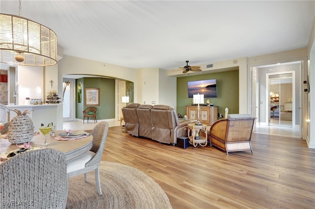 dining room featuring light hardwood / wood-style floors and ceiling fan