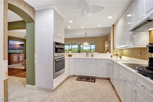 kitchen with white cabinets, ceiling fan, pendant lighting, light hardwood / wood-style floors, and sink