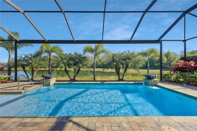 pool with a patio area and glass enclosure