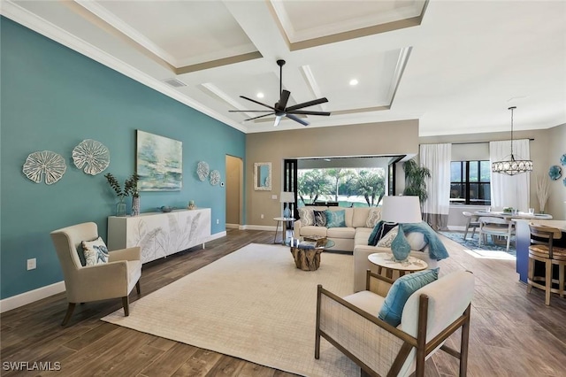 living area featuring visible vents, ornamental molding, wood finished floors, coffered ceiling, and baseboards