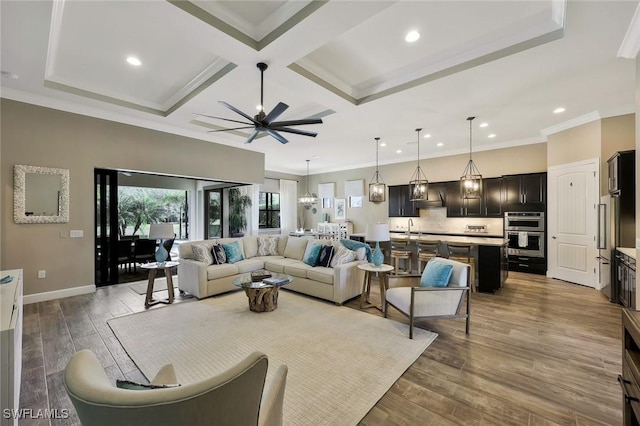 living room with baseboards, coffered ceiling, wood finished floors, crown molding, and recessed lighting