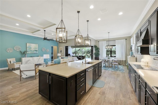 kitchen with a sink, light countertops, stainless steel dishwasher, ornamental molding, and light wood finished floors