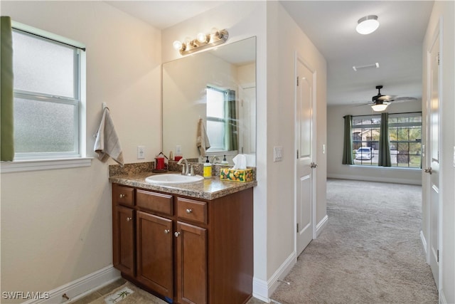 bathroom featuring vanity and ceiling fan