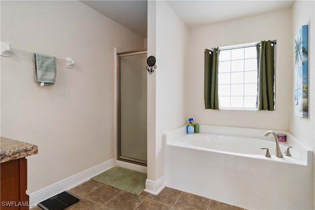 bathroom featuring vanity, tile patterned floors, and separate shower and tub