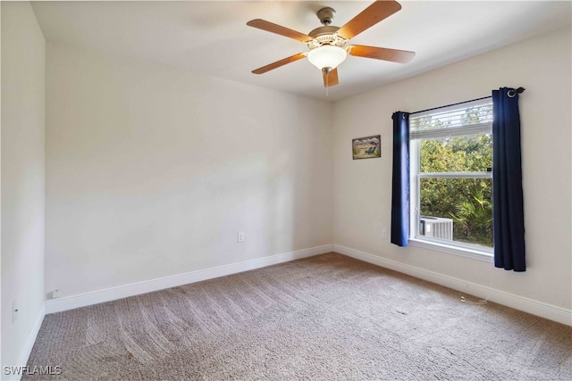 empty room featuring carpet flooring and ceiling fan