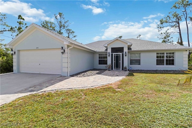 single story home featuring a garage and a front lawn