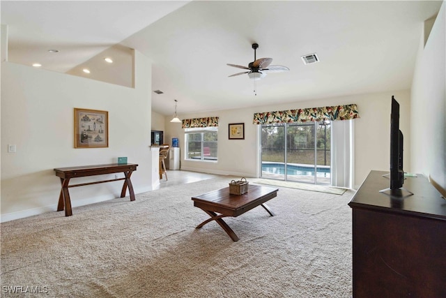 carpeted living room featuring lofted ceiling and ceiling fan