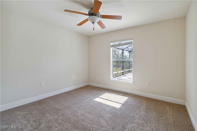 empty room with carpet floors and ceiling fan