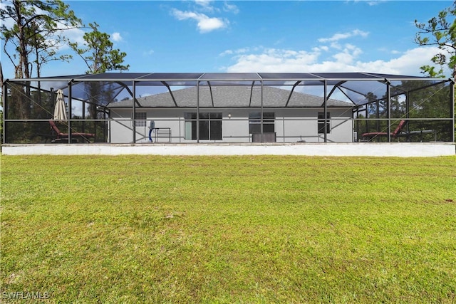 back of house featuring a yard and a lanai