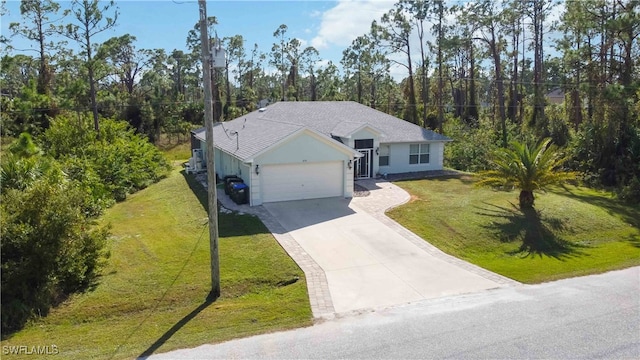 single story home featuring a garage and a front lawn