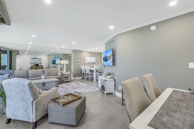 living room featuring crown molding