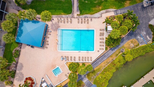 birds eye view of property featuring a water view