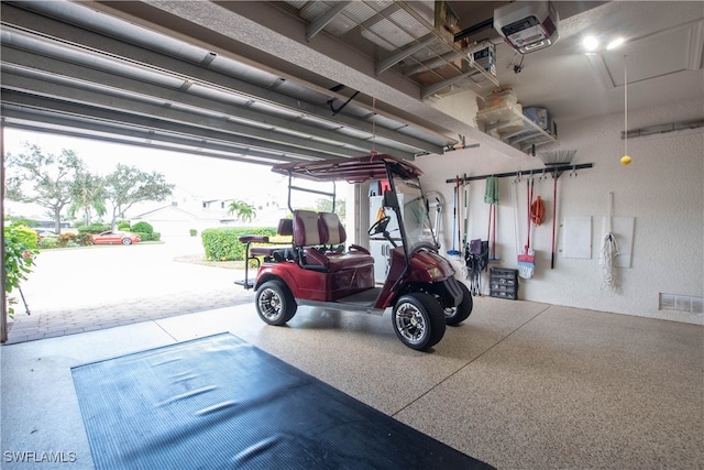 garage featuring a garage door opener