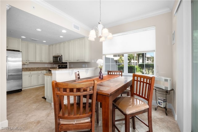 tiled dining room with ornamental molding and an inviting chandelier