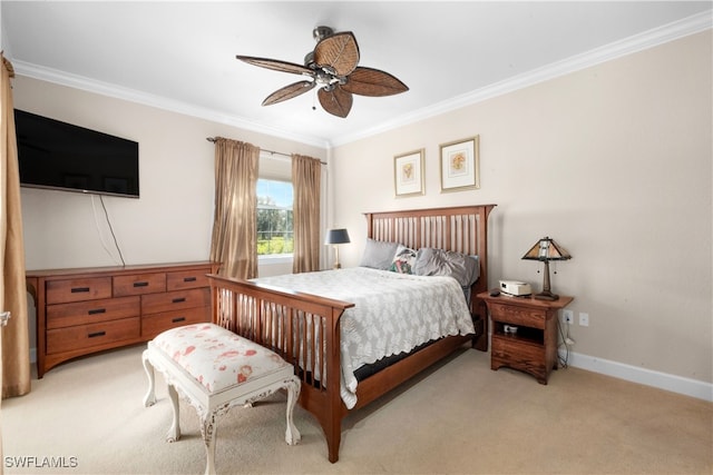 carpeted bedroom with ceiling fan and crown molding