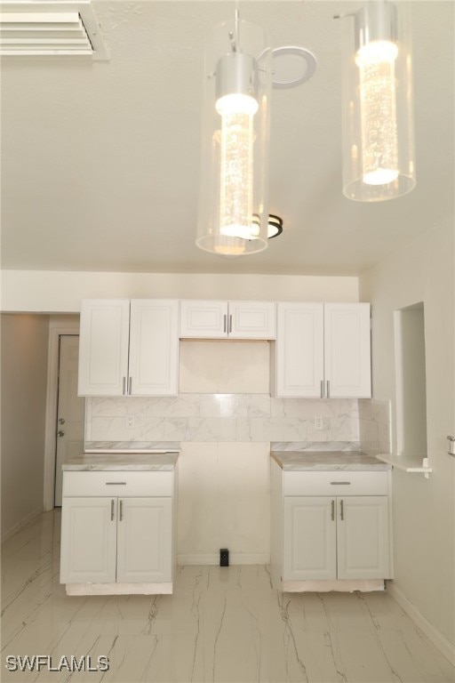 kitchen with white cabinetry