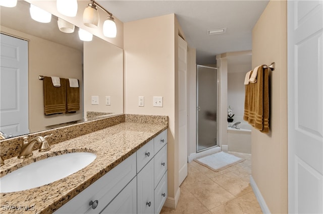 bathroom featuring tile patterned floors, vanity, and plus walk in shower