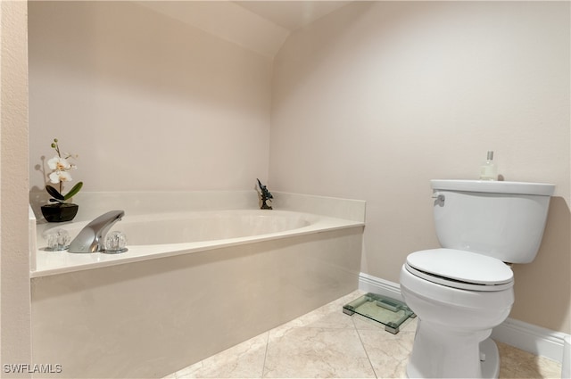 bathroom with toilet, tile patterned floors, a tub to relax in, and vaulted ceiling