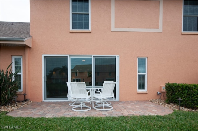 rear view of property featuring a patio area