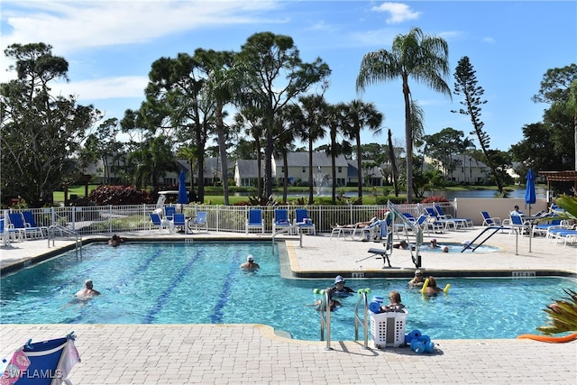 view of swimming pool with a patio