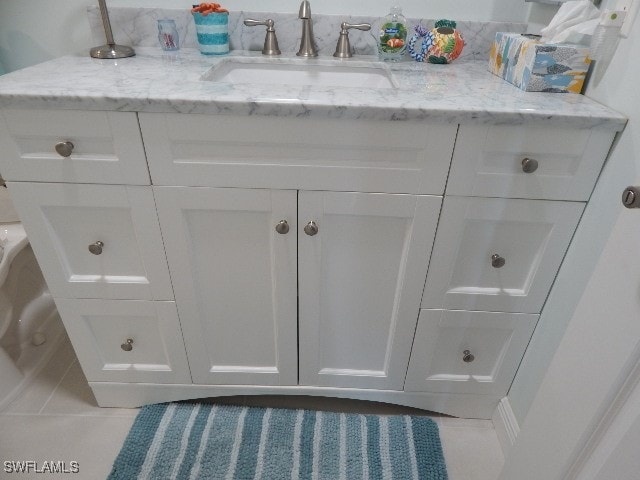 bathroom with vanity and tile patterned flooring