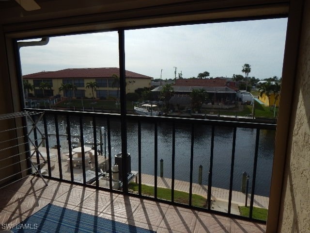 balcony featuring a water view