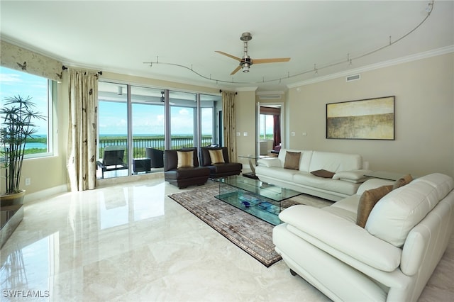 living room featuring ornamental molding, a wealth of natural light, a water view, and ceiling fan