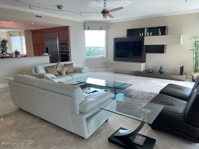 living room with ceiling fan, plenty of natural light, and crown molding