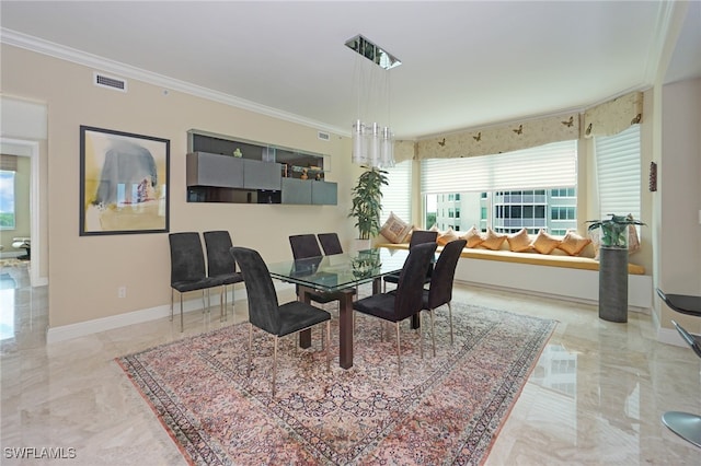 dining space with crown molding