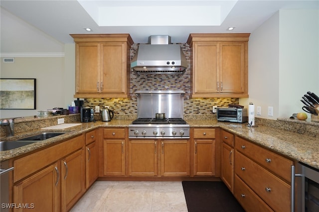 kitchen with wine cooler, ornamental molding, stainless steel gas stovetop, wall chimney range hood, and decorative backsplash