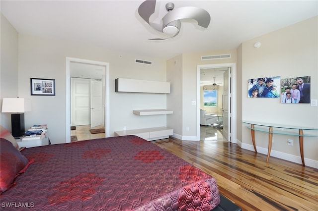 bedroom featuring hardwood / wood-style flooring and ceiling fan