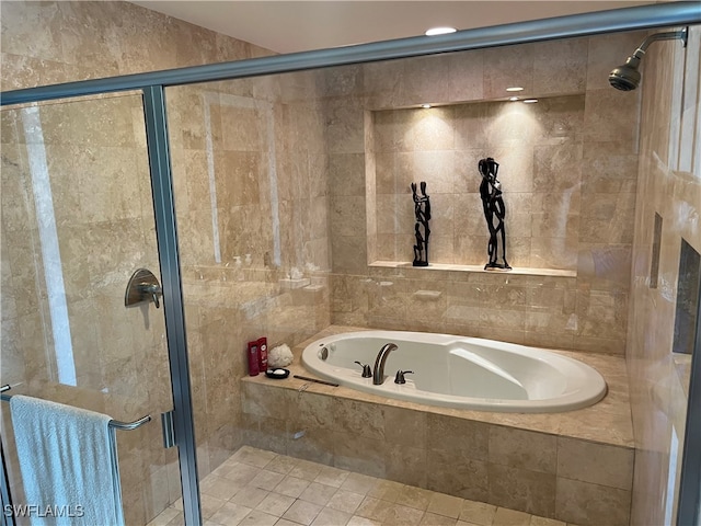 bathroom featuring independent shower and bath and tile walls