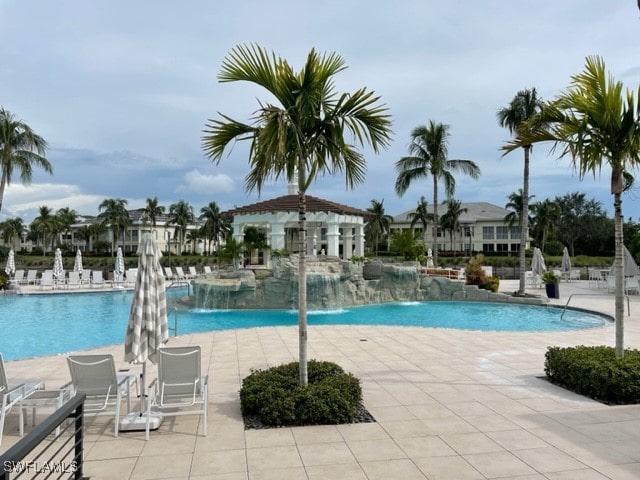 view of pool featuring a patio area and pool water feature