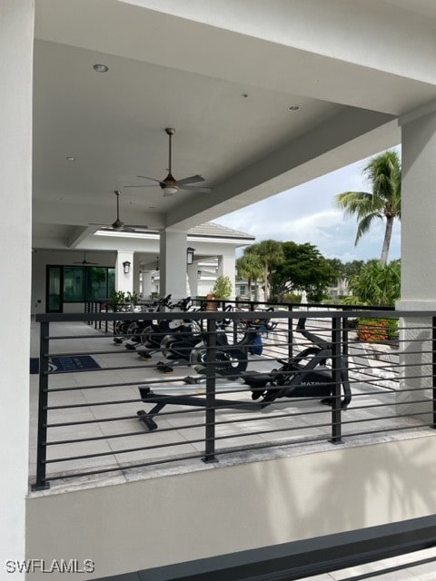 exterior space featuring ceiling fan and a balcony