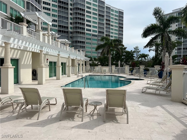 view of swimming pool featuring a patio