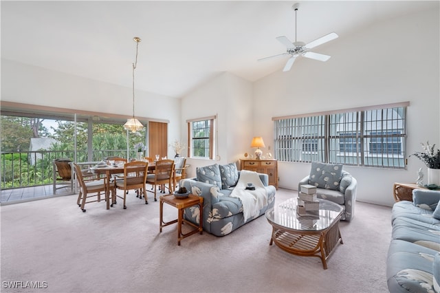 carpeted living room featuring high vaulted ceiling and ceiling fan